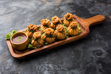 Crispy Potli Samosa or veg money bags are delicious Indian snacks of spiced aloo and mix veggies Or Meat/kheema  stuffed in flaky dough. It's a great creative starter or appetiser. served with ketchup
