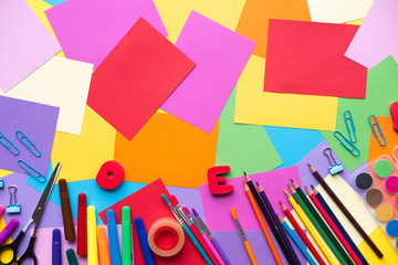 School supplies lay on colorful   background, back to school concept, copy space