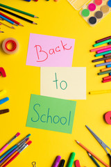 School supplies on colorful background. Concept back to school.