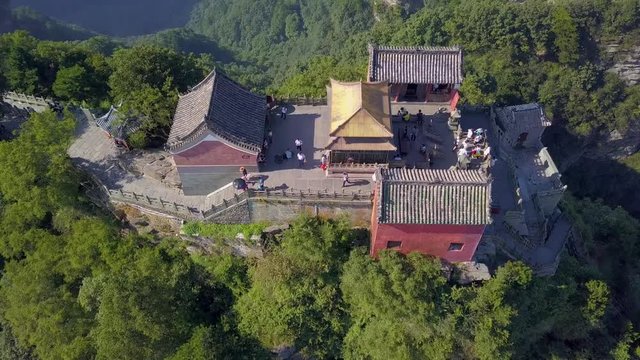 Aerial views from above to ancient and perfectly preserved temple of Golden Palace in Wudang Mountains. Complex of temples built by Ming dynasty. Hubei province, China