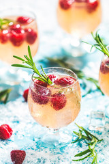 Christmas pink drink raspberry with rosemary and ice