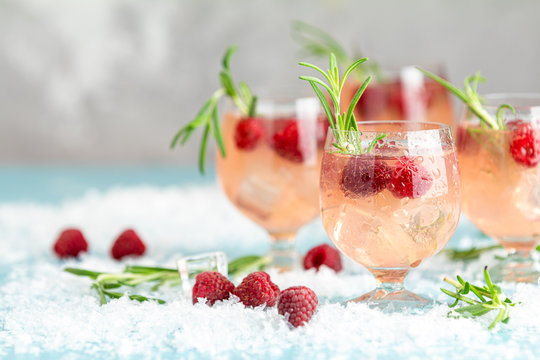 Christmas pink drink raspberry with rosemary and ice