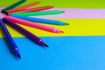 Assortment of crayons on color background