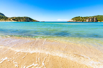 Obraz premium Voidokilia Beach, popular white sand and blue clear water beach in Messinia in Mediterranean area in shape of Greek letter omega, Peloponnese, Greece.