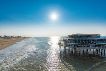 Sunny day on North sea beach in Netherlands in Scheveningen, tourist and vacation destination in Europe