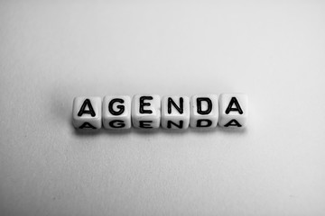 White cubes with word AGENDA on white background