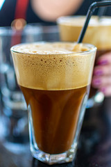Traditional greek cold coffee Frappe made from water, instant coffee and ice cubes