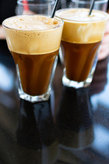 Traditional greek cold coffee Frappe made from water, instant coffee and ice cubes