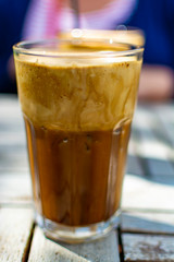 Traditional greek cold coffee Frappe made from water, instant coffee and ice cubes