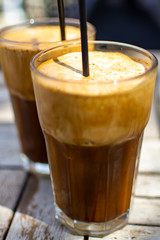 Traditional greek cold coffee Frappe made from water, instant coffee and ice cubes