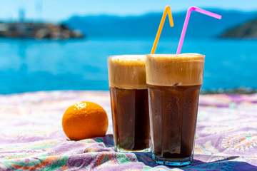 Traditional greek cold coffee Frappe made from water, instant coffee and ice cubes