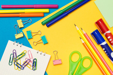 Stationery. School and office supplies on a colored background. Selective focus