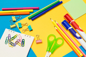 Stationery. School and office supplies on a colored background. Selective focus