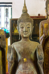 Lan Chang Buddha statue art in various temples in Luang Prabang, Laos.