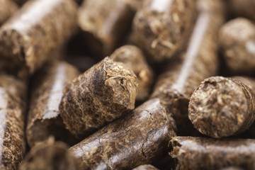 Wooden pellets made out of sawdust closeup