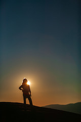 Young girl looking out from on top of a mountain, Stowe, Vermont, USA