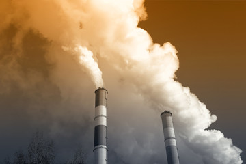 Stream of smoke from the chimney of factory. Toned image