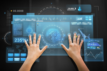 technology and people concept - hand using black interactive panel with virtual projections of charts