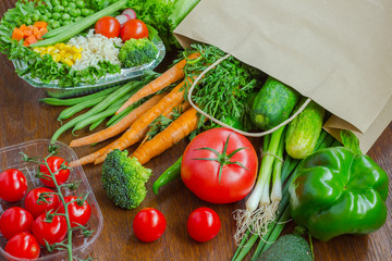 Healthy food in full paper bag of different products, vegetables. Top view. Food background