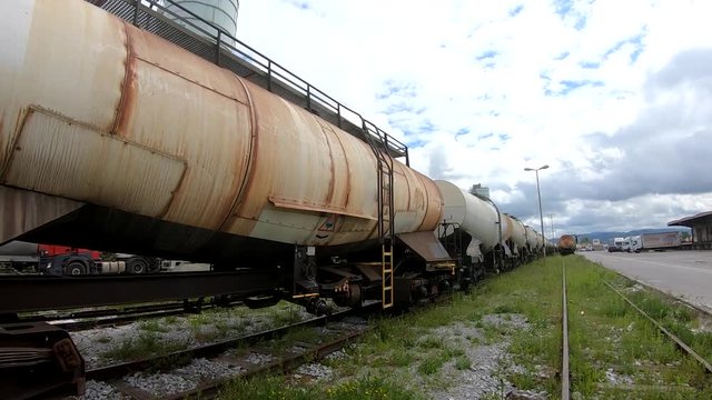 Wagons for liquids waits for further transportation on train depot