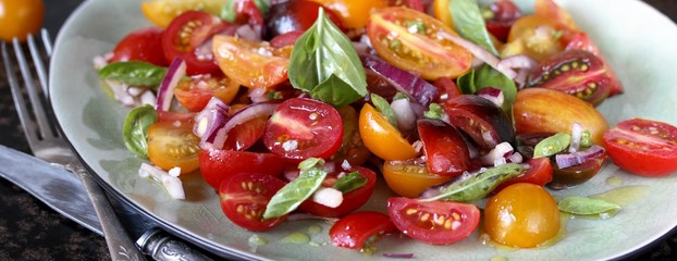 cherry tomato salad with basil and red onion, large sea salt and olive oil