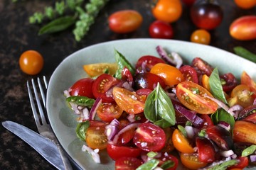 cherry tomato salad with basil and red onion, large sea salt and olive oil