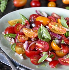 cherry tomato salad with basil and red onion, large sea salt and olive oil