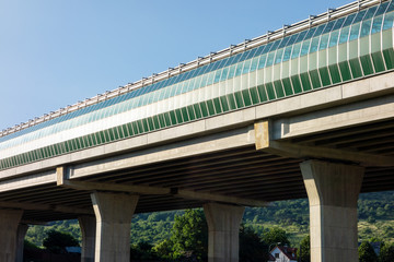 A modern highway bridge covered with glass