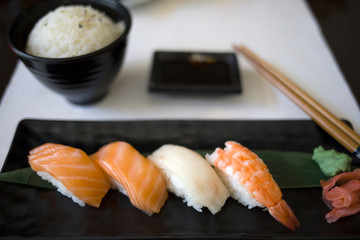 Variety of sushi food. Top view of nigiri, wasabi and maki. Traditional asian food with raw fish and rice. Time to eat eat concept.