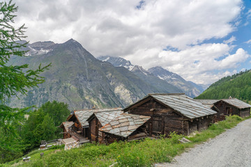 Fototapeta na wymiar traditional wooden houses in the village of Tufteren, high above Zermatt, the famous touristic destination in the canton Valais, Wallis, Switzerland