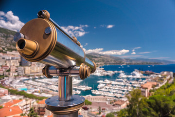 Telescope with a view of yachts in Monaco