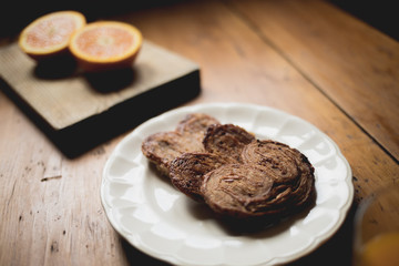 Breakfast time, table ready with sweets, orange. Morning and healthy lifestyle concept