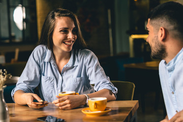 woman enjoying her time with her boyfriend at a cafe