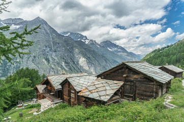 Obraz premium traditional wooden houses in the village of Tufteren, high above Zermatt, the famous touristic destination in the canton Valais, Wallis, Switzerland