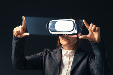 Businesswoman wearing virtual reality headset