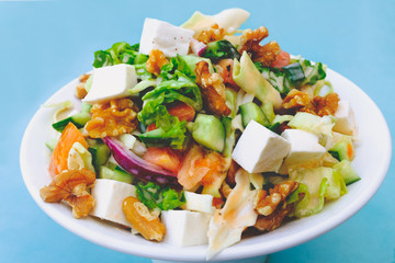 Fresh mixed salad. Healthy vegetarian food. Selective focus
Mediterranean Salad with corn, lettuce, cucumber, tomato and greek olive oil.

.