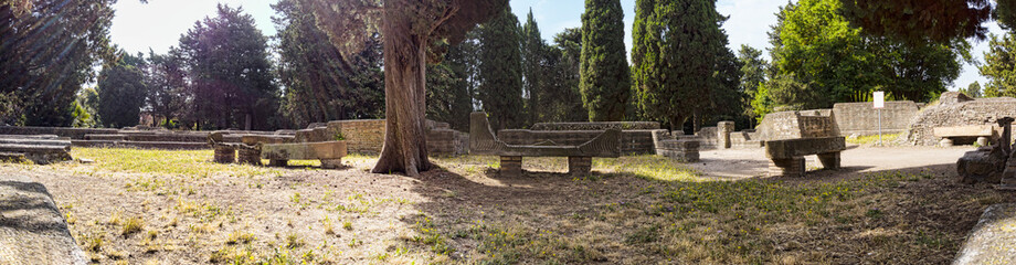 Immersive panoramic 180 degree view of ancient Roman necropolis landmark in the archaeological excavations of Ostia Antica with many sarcophagus and graves  - Rome