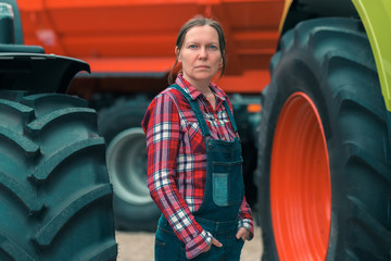 Female farmer and agricultural tractor