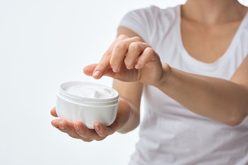 young woman with cosmetic cream