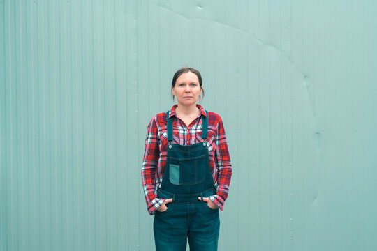 Serious Female Farmer Posing On Farm