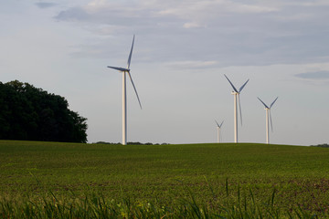 Giant wind turbines in a rural agricultural setting