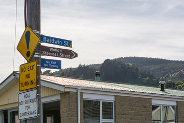 Baldwin Street signs, now considered the second steepest residential street in the world, Dunedin, New Zealand.