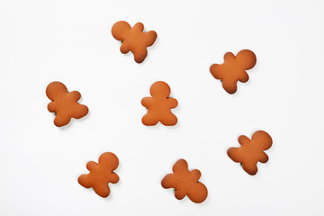 The hand-made eatable gingerbread little men on white background