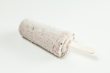 Ice cream - tasty and refreshing popsicle flavored cookies and cream, photo on neutral background