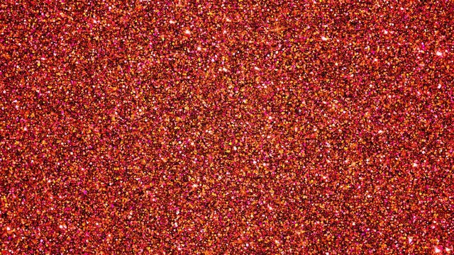 Sparkling Fire Opal Glitter Particles. Seamlessly looping animated background.