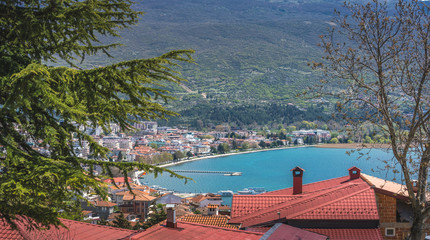 Red tiled rooftops of  houses on the shore of Lake Ohrid