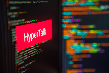 Programming language, Hyper Talk inscription on the background of computer code.