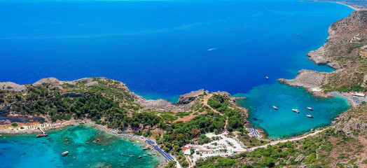 Aerial birds eye view drone photo Anthony Quinn and Ladiko bay on Rhodes island, Dodecanese, Greece. Panorama with nice lagoon and clear blue water. Famous tourist destination in South Europe