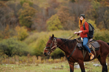 young woman riding horse