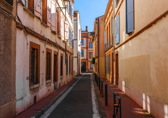 Street in French ancient town Toulouse. Toulouse is the capital of Haute Garonne department and Occitanie region, France, South Europe. Famous tourist destionation.